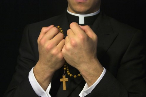 young-priest-praying-the-rosary-gregory-dean