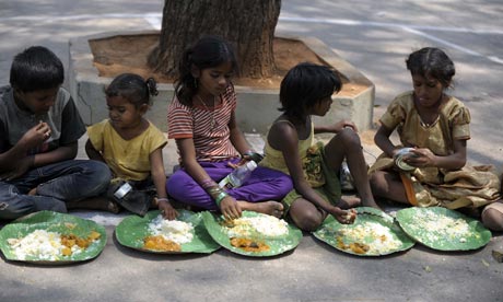 MDG : Malnutrition : Indian homeless eat food at a feeding programme for poor in Hyderabad, India