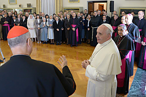 October 15, 2013 : Pope Francis greets Card. Tarcisio Bertone during the farewell ceremony at the office of the Secretary of State, in the presence of the Superiors and Officials in the Library of the Secretary of State at the Vatican.