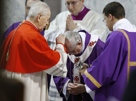 Pope Francis receives ashes from Cardinal Tomko during Ash Wednesday Mass at Basilica of Santa Sabina in Rome